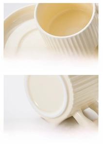 Detail of smooth ceramic cup rim and non-slip unglazed base of ivory coffee mug