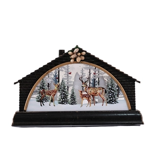 Christmas reindeer scene decorative light box with black brick frame and pine cone decor