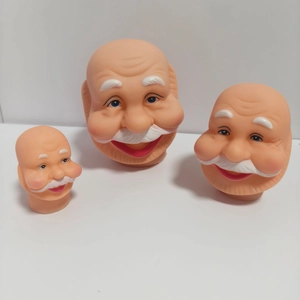 Detailed view of three mini Santa Claus vinyl heads in various sizes for DIY crafts