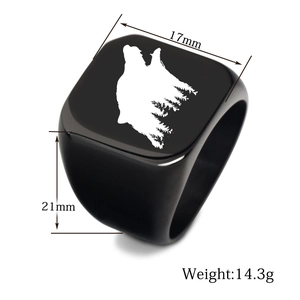 Detailed view of black wolf and forest silhouette laser engraving on a square signet ring