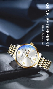 Detail of quartz watch with sunray dial, date display, and two-tone stainless steel strap