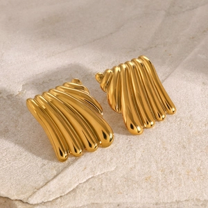 Macro shot of 18K gold-plated stainless steel square earrings with wave texture