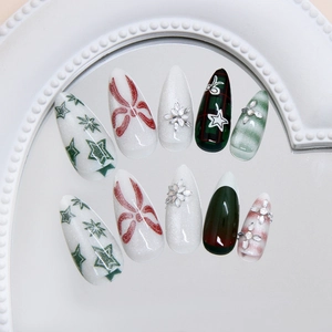 Christmas cat eye press-on nails with red green plaid, snowflakes and rhinestones