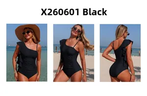 Detail of black one-shoulder swimsuit with elegant ruffles and slimming pleated design