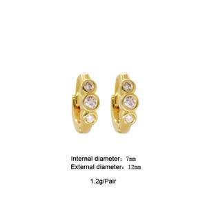 Detailed view of gold hoops with three clear zircons, 12mm outer diameter and 7mm inner