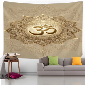 Close-up of golden Om symbol and intricate Mandala pattern on beige tapestry fabric