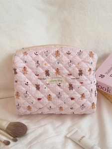 Pink quilted cotton makeup bag with cute happy bear patterns and zipper closure