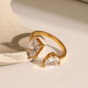 Detailed view of an adjustable gold-plated ring with teardrop and rhombus zircon stones