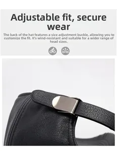 Close-up of the adjustable metal buckle and textured leather strap on the baseball cap