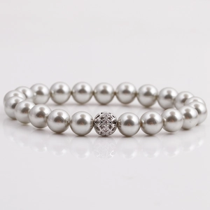 Detailed close-up of silver-gray pearl bracelet with a silver hollow rhinestone centerpiece
