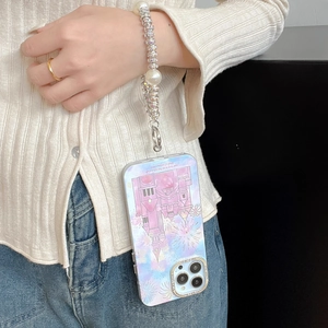 Detail of luxury pearl and rhinestone beaded wrist strap on a dream castle phone case