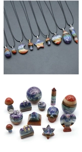 Macro detail of assorted chakra stones carved into heart, star, and moon shapes