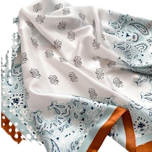 Elegant paisley satin silk scarf with orange border and blue floral pattern details