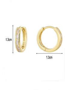 Macro detail of S925 sterling silver huggie earrings with rectangle zircon, 1.3cm diameter