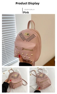 Detailed macro view of a pink mini backpack with polished metal studs and PU leather texture