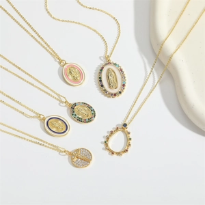 Set of gold religious pendant necklaces with colorful enamel and crystal detailing