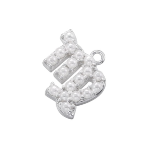 Detail of silver letter D pendant charm featuring white pearls on white background