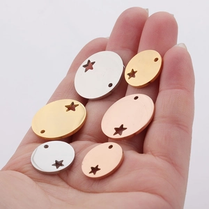 Polished stainless steel oval charms with hollow star cutout in gold, silver and rose gold