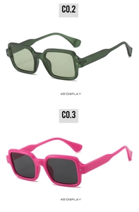 Detail of square sunglasses with metal rivet accents in translucent green and pink colors