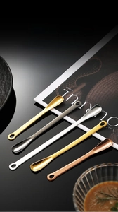 Macro detail of long handle SUS304 stainless steel spoons in gold and silver finishes