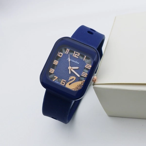 Detail of square navy blue quartz watch with rose gold numbers and swan motif