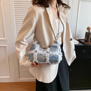 Chic blue denim chain handbag with frayed plaid design and silver metallic strap