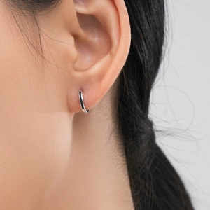 Elegant S925 sterling silver huggie earrings with black square zircon inlays on model