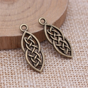 Antique bronze leaf-shaped Celtic knot pendants with intricate hollow weave patterns