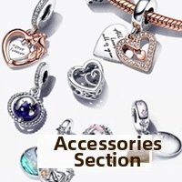 Detailed close-up of heart charms and enamel beads for DIY charm bracelets