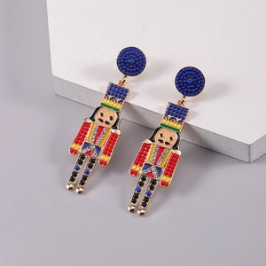 Detailed macro view of nutcracker beaded earrings with red blue beads and rhinestones