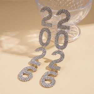 Detail view of silver drop earrings featuring 2026 number design with sparkling rhinestones