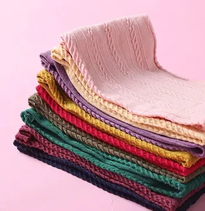 Macro shot of colorful cable knit nylon headbands showing textured fabric detail