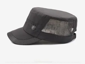 Detail of dark grey army cap showing breathable mesh side panels and metal logo
