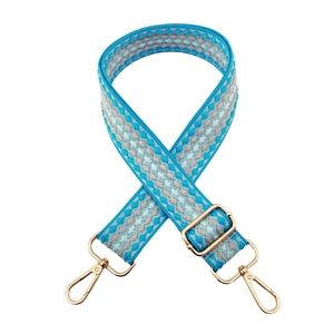 Adjustable wide replacement bag strap with blue and beige geometric pattern and gold hardware