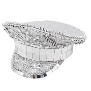 Detail of silver captain hat featuring rhinestones, metallic studs, and mirror tiles
