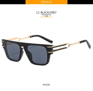 Detail view of modern black frame sunglasses with hollow gold metal side temples