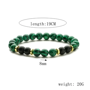 Detail of beaded bracelet with 8mm malachite and black beads showing 19cm length