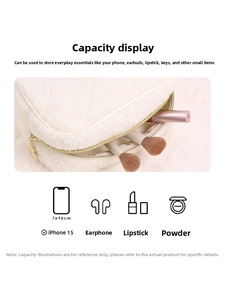 Detailed view of cream teddy fleece quilted makeup bag with star charm and large capacity
