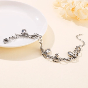 Double-layered silver steel chain bracelet with polished beads and teardrop charm