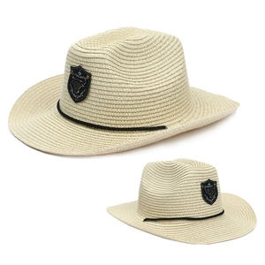 Western straw cowboy hat with bull head emblem and black decorative cord on wide brim