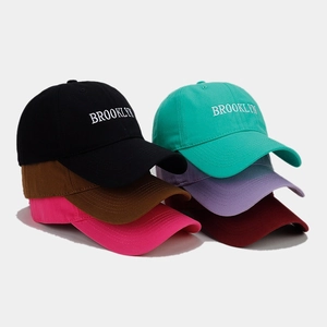 Detailed view of six colorful Brooklyn embroidery baseball caps in twill cotton fabric