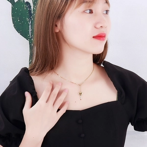Minimalist gold stainless steel necklace with a sweet heart-shaped key pendant for women