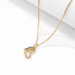 Detail of MOM heart pendant with colorful zircon stones on a gold box chain necklace