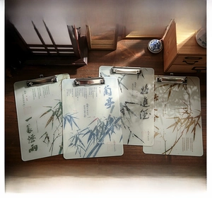 Detail of acrylic clipboards featuring Chinese ink bamboo art and calligraphy designs