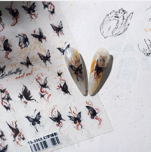 Detail of Chinese ink style butterfly nail stickers on iridescent pointed false nails