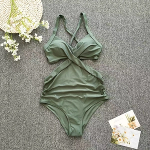 Flat lay of olive green one-piece swimsuit featuring cross-wrap design and slim fit pleats