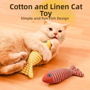 Cat interaction with durable linen fish toy showing wave textures on wooden floor