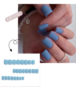 Detailed view showing matte light blue press on nails with elegant short square styling
