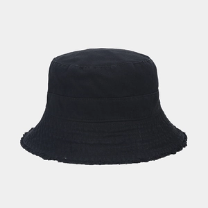 Detailed view of black cotton bucket hat featuring unique frayed edges and twill texture