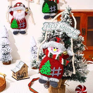 Close-up of a festive snowman ornament with Feliz Navidad banner on a Xmas tree